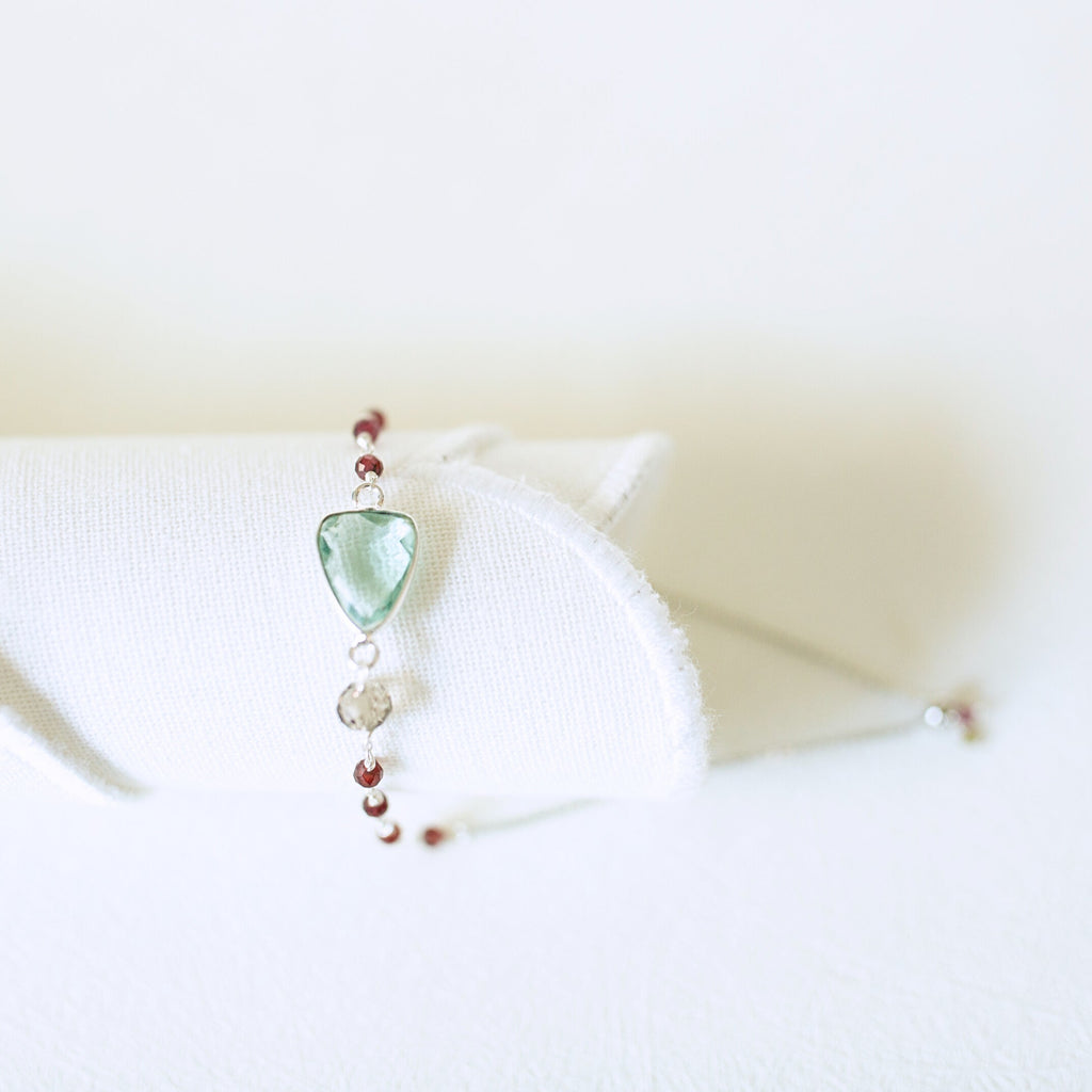 Pale green gemstone Isla bracelet with silver-tone links and small bead accents.