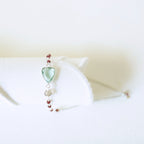 Pale green gemstone Isla bracelet with silver-tone links and small bead accents.