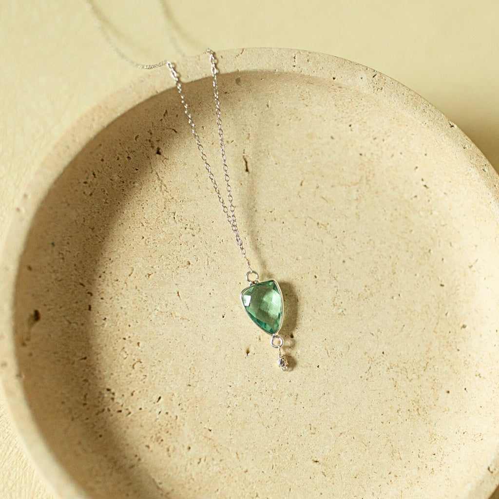 Pale green faceted Isla pendant with a small drop detail on a silver-tone chain.