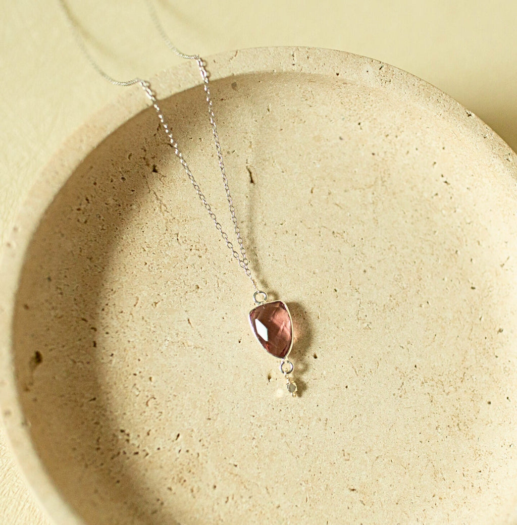 Pink faceted Isla pendant with a small drop detail on a silver-tone chain.