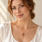 The Isla Pendant — Rhodolite Garnet / 14k Gold Plated Silver styled on a model; AI-generated lifestyle image.