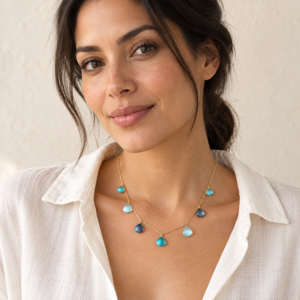 The Azzurra Necklace — 14k Gold Plated styled on a model; AI-generated lifestyle image.