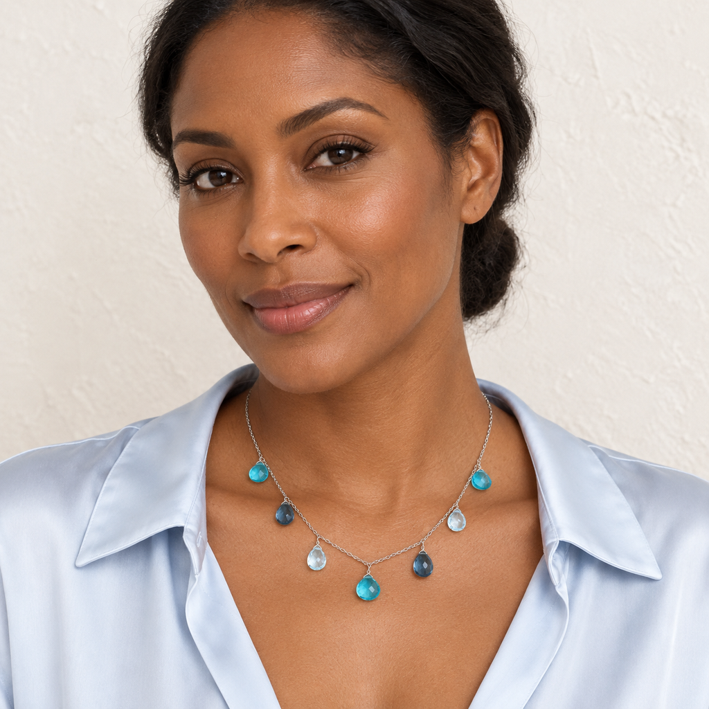 The Azzurra Necklace — Silver styled on a model; AI-generated lifestyle image.