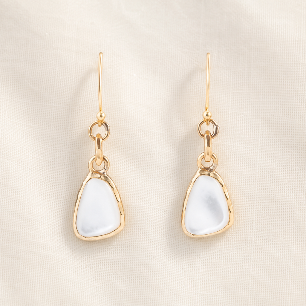 White mother-of-pearl drops suspended from bronze links and ear wires