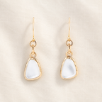 White mother-of-pearl drops suspended from bronze links and ear wires