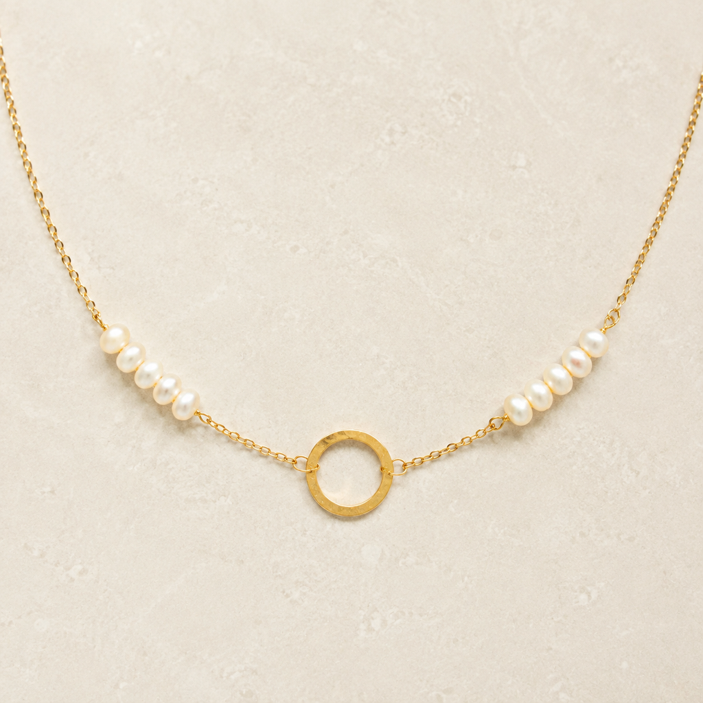 The Pearl — freshwater pearls, fine gold-plated silver chain and open circle in a refined ivory setting.