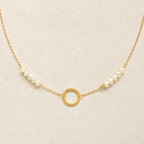 The Pearl — freshwater pearls, fine gold-plated silver chain and open circle in a refined ivory setting.