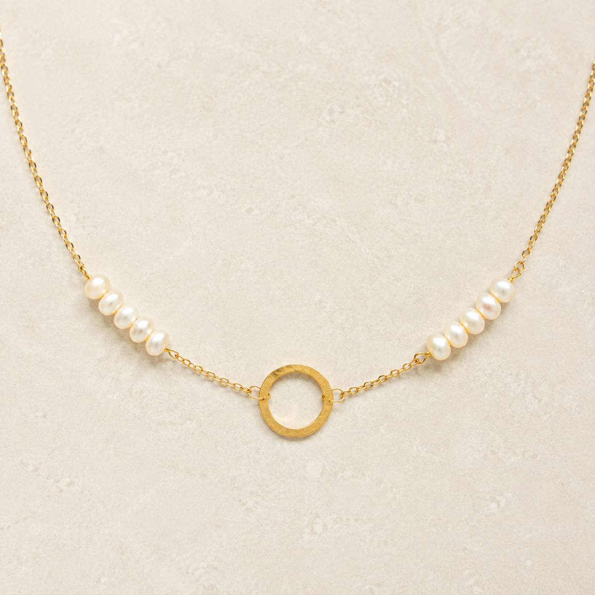 The Pearl — freshwater pearls, fine gold-plated silver chain and open circle in a refined ivory setting.