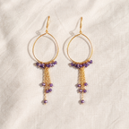 Teardrop gold-plated silver hoops with amethyst beads and fine chain tassels