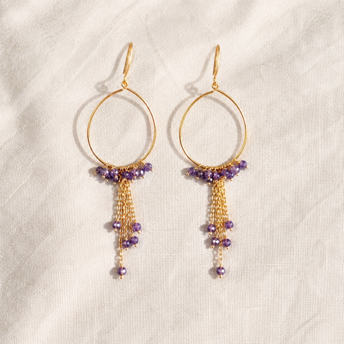 Teardrop gold-plated silver hoops with amethyst beads and fine chain tassels