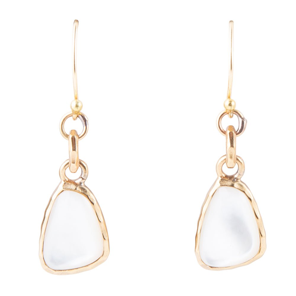 The Nacre Drops: front view of white mother-of-pearl earrings in bronze bezels with linked connectors and hook ear wires.